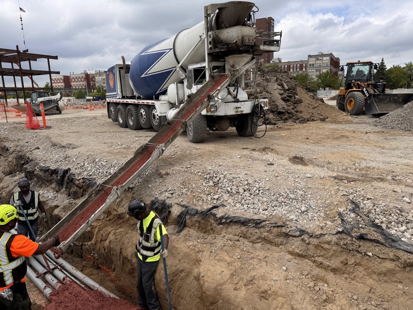Gayanga crew guiding a concrete pour on the Henry Ford Health expansion, 2025