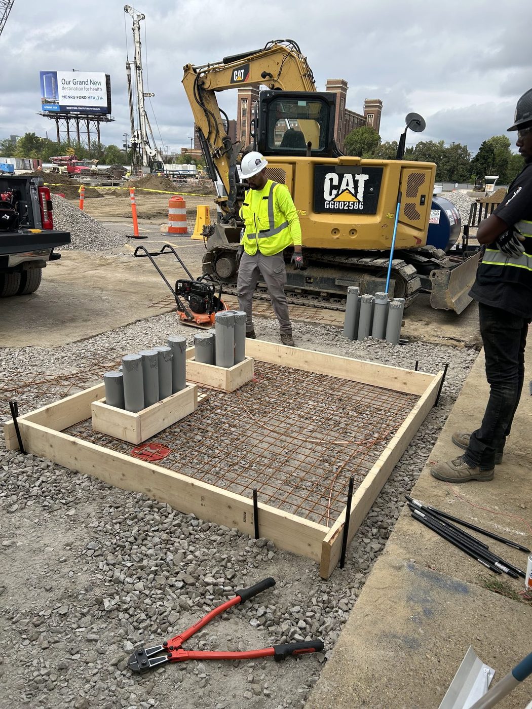 Gayanga crew forming an underground electrical duct bank and equipment pad for an electrical contractor